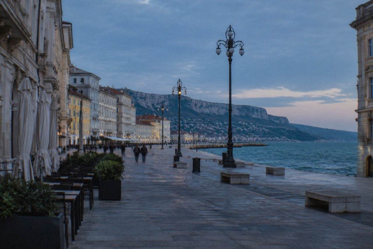 The seafront square of Trieste in Italy with historic facades and the Adriatic sea beyond