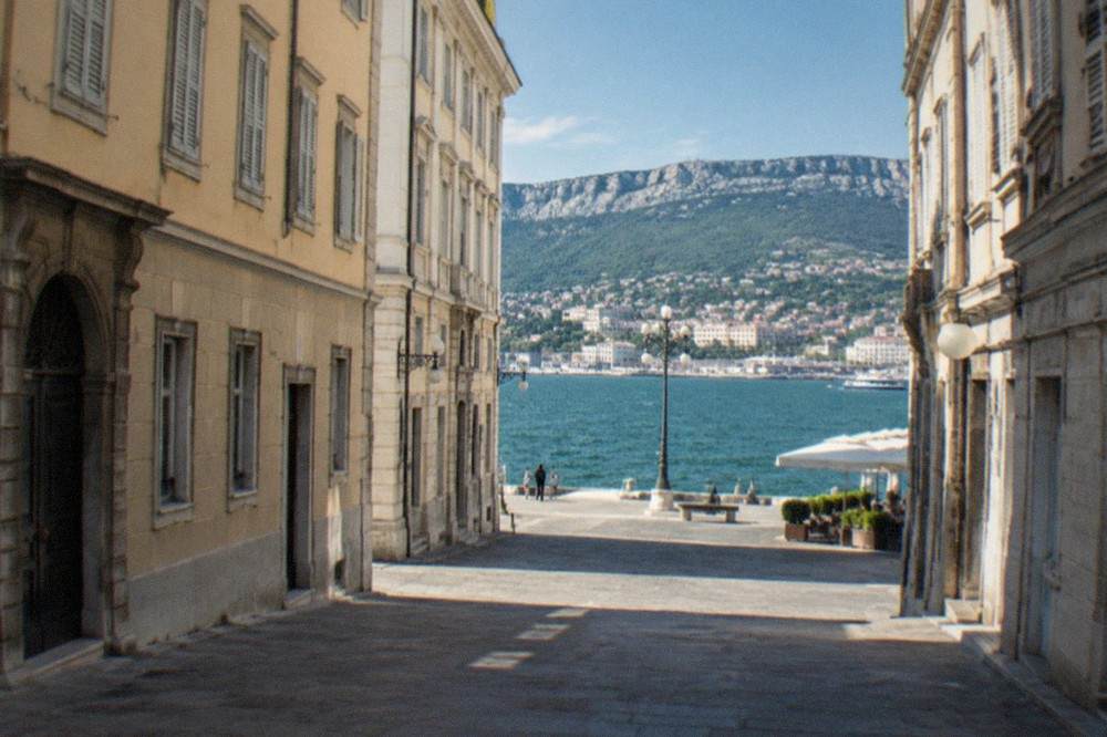A coastal town on the Slovenian side of the Gulf of Trieste, seen across the water from Italy