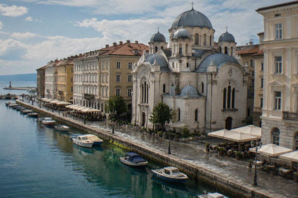 Trieste's canal district with the Serbian Orthodox church and historic cafés along the water