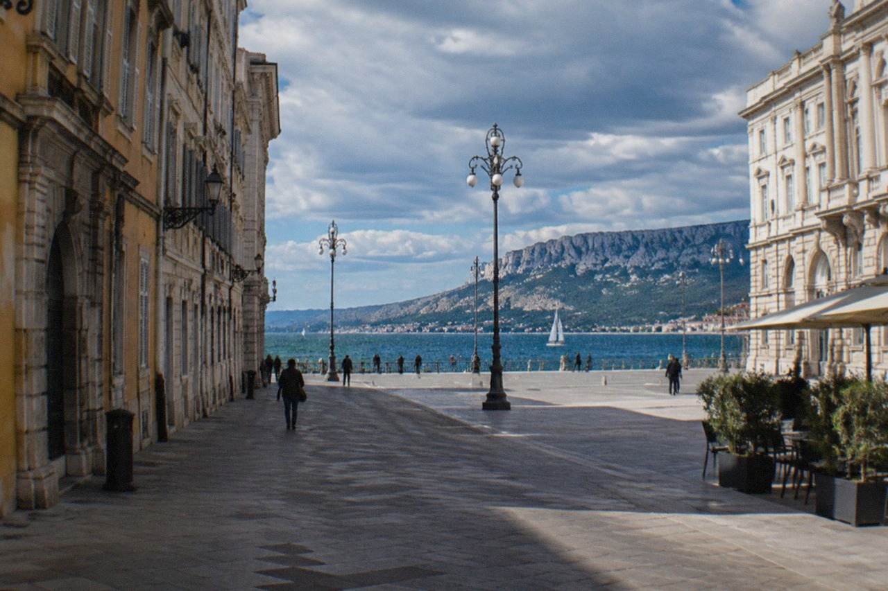 Neoclassical buildings along the Trieste seafront with the piazza and gulf in the background