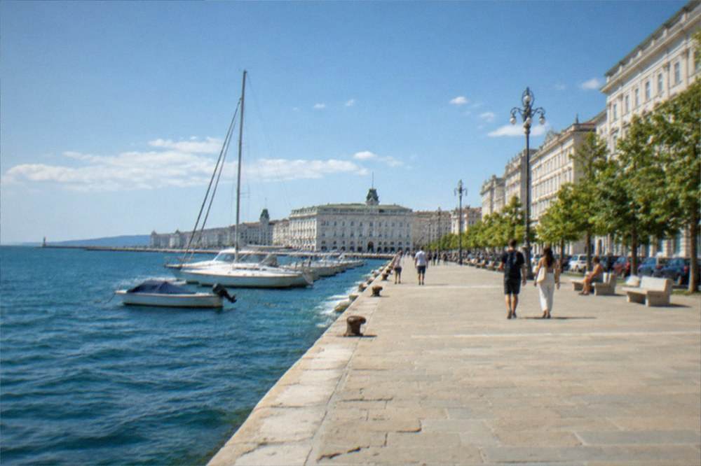 A wide view of Trieste's seafront promenade with the city's waterfront square opening onto the Adriatic