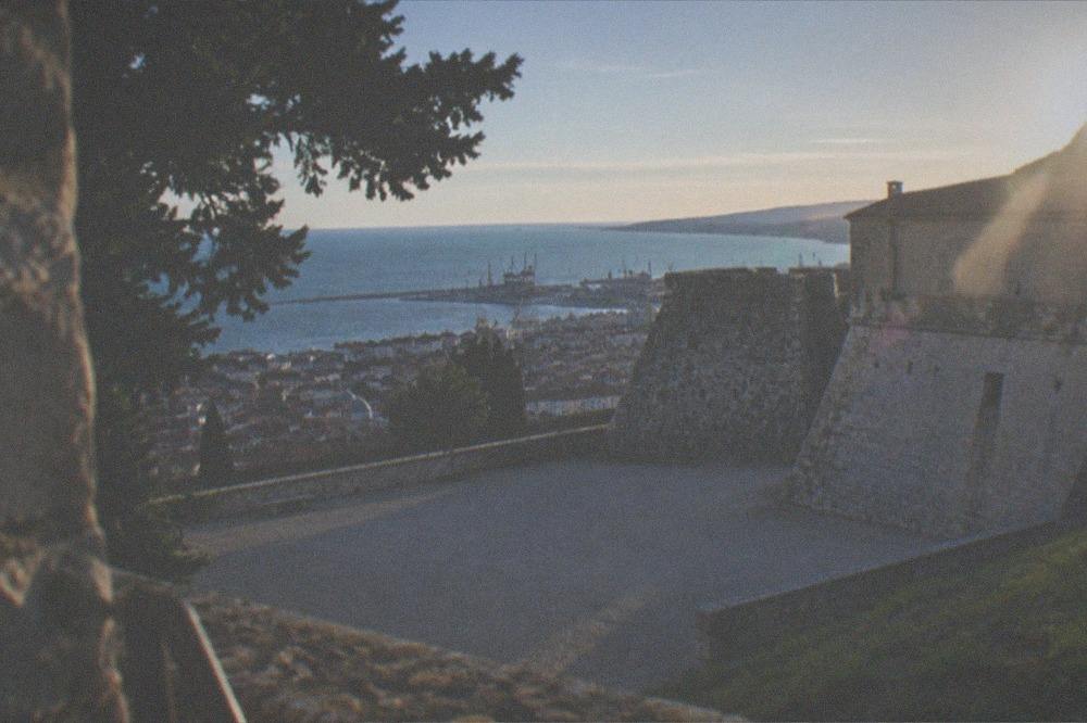 The walls and bastions of Castello di San Giusto seen from the hill terrace