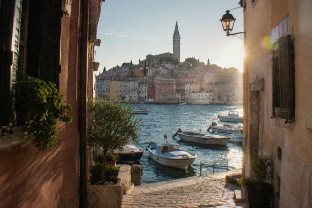 Narrow lane in Rovinj old town with pastel painted houses