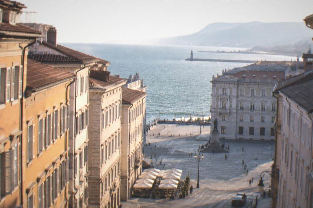 Evening light over the Gulf of Trieste with the coastline and distant hills