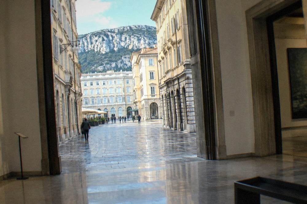 A museum gallery in Trieste with wide doorways and a level polished floor
