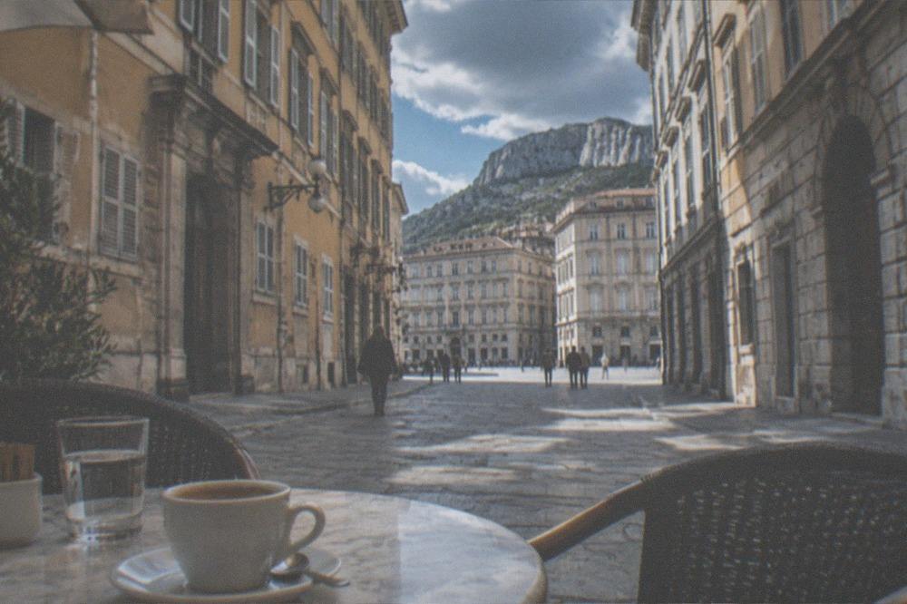 A cup of coffee on a marble table in a historic Trieste caffè