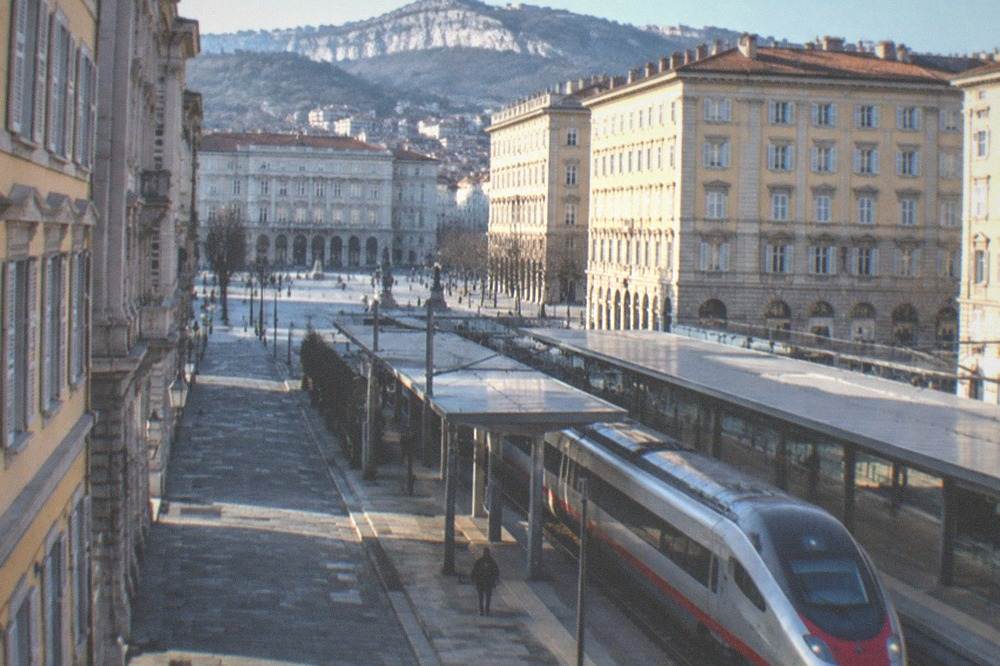 A high-speed train on a platform at an Italian railway station