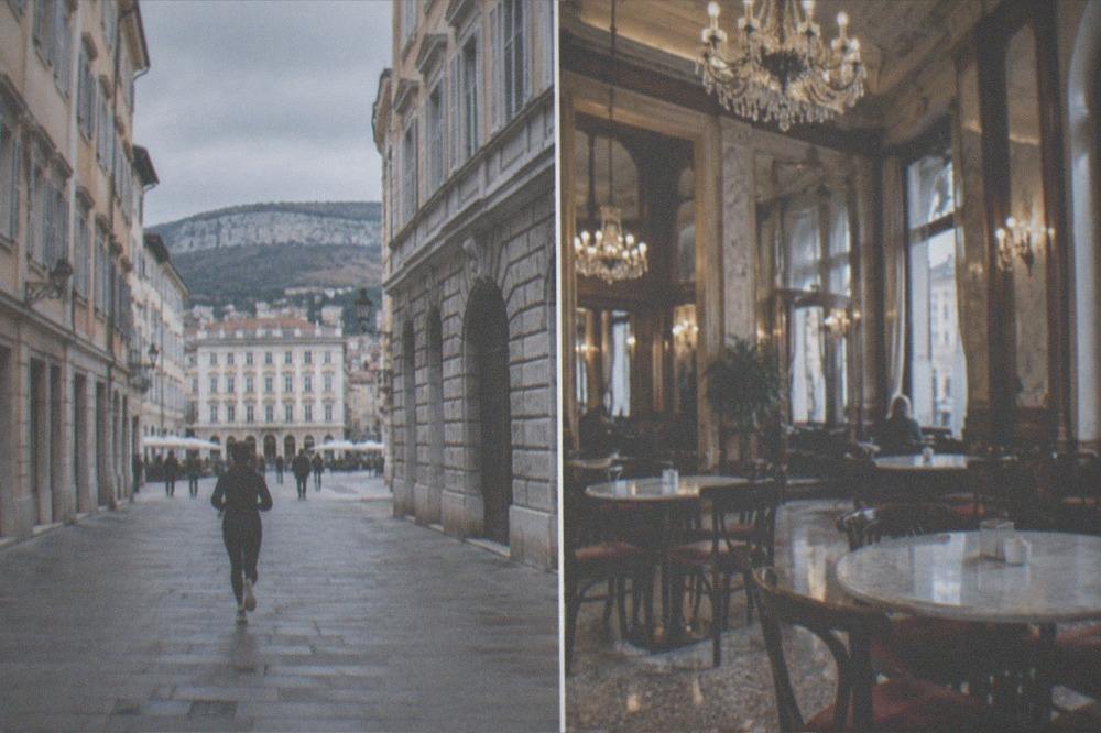 An elegant historic cafe interior with marble tables and chandeliers in Trieste