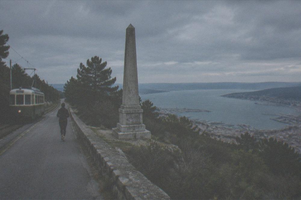The Opicina tram climbing the hillside above Trieste with the gulf below